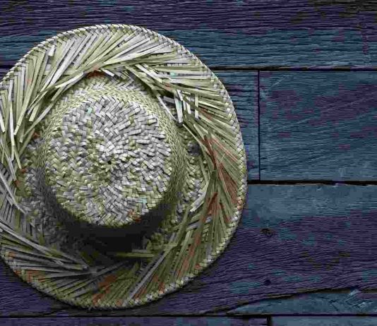 Old Straw hat Wooden Surface